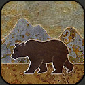 Stone mosaic silhouette bear and mountains.